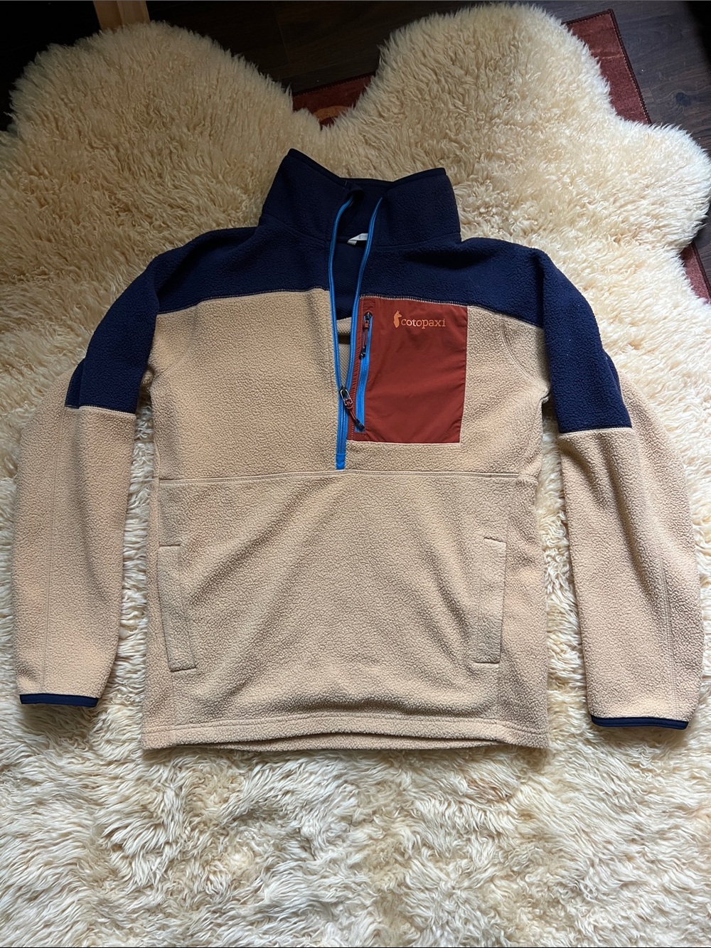Cotopaxi Men’s Tan and Navy Fleece Half-Zip with Rust Chest Pocket